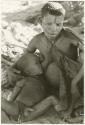 Tsekue nursing N!whakwe (print is a cropped image)