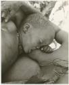 Tsekue nursing N!whakwe, close-up (print is a cropped image)