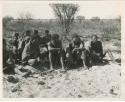 "Groups: women & children": Group of men sitting (print is a cropped image)