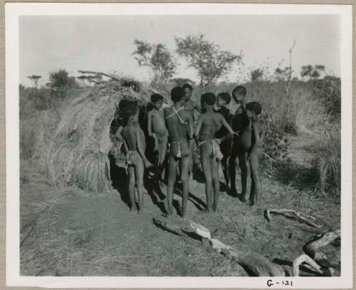 "Boys groups  /Gunda & //Ao": Group of boys standing next to a skerm (print is a cropped image)