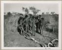 " Boys groups  /Gunda & //Ao": Group of boys standing next to a skerm (print is a cropped image)