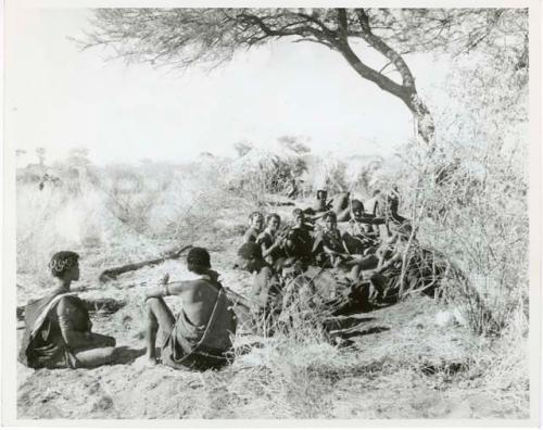 "Band 2, Gao Helmet #28 & extended family": "Gao Helmet" sitting with his extended family and relatives, including Khuan//a of Band 4, Khwo//o-/Gasa and her husband ≠Gao, //Kushay, /Gasa, //Khuga, "Old /Gam," Xama, //Kushay, /Tuka, and ≠Toma (print is a cropped image)