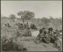 [No folder title]: Group of people sitting (print is a cropped image)