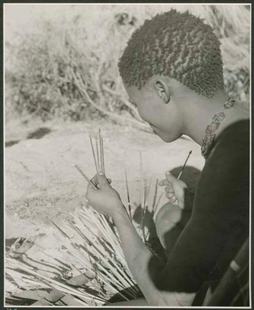 [No folder title]: //Ao looking at arrows, view from over his shoulder (print is a cropped image)