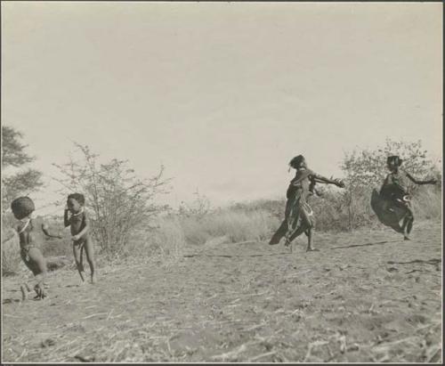 /Gaishay ("Gao Medicine's" son) and "Little ≠Gau" ("/Qui Navel's" son) playing or dancing (left), and young women playing tamah n!o’an (ball game)
