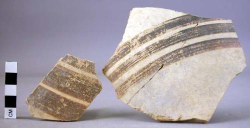 2 potsherds with coarse black bands