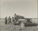 Laurence Marshall with Jeep full of children, including Ngani (left)

