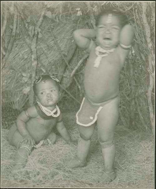 Two babies; one crying
 

