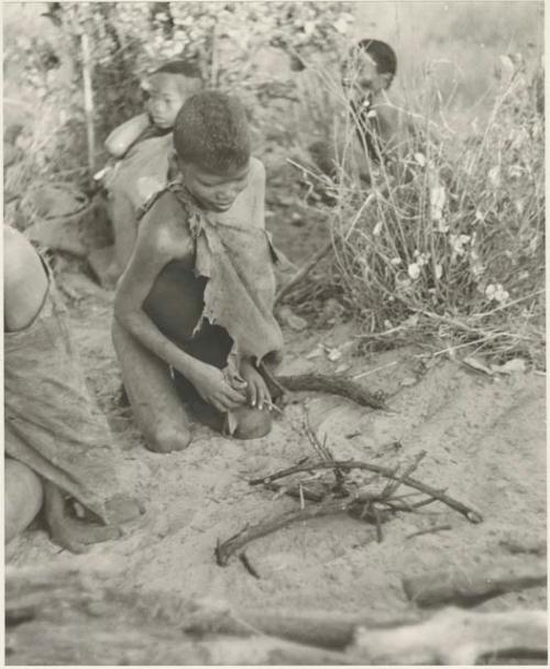 Boy from "visiting group" starting a fire