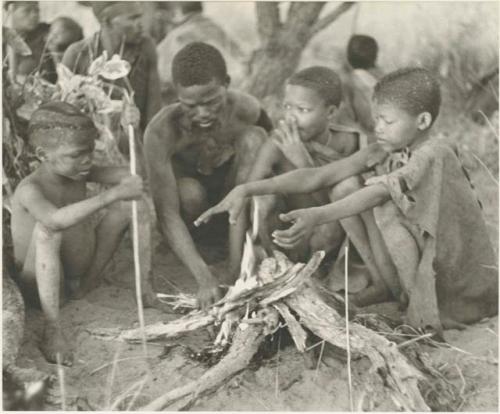 Group of visitors sitting around their fire