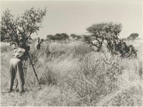 Lorna Marshall photographing John Marshall, who is filming a group of people dancing