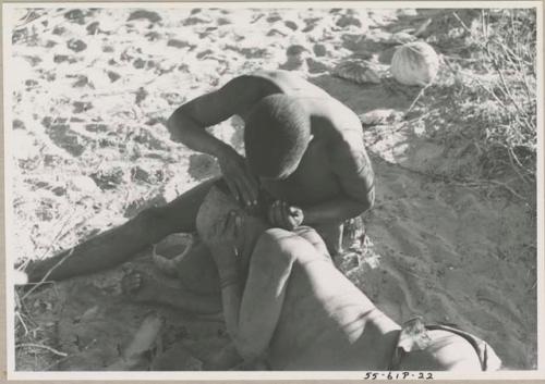 !Gai seated, cutting another man's hair



