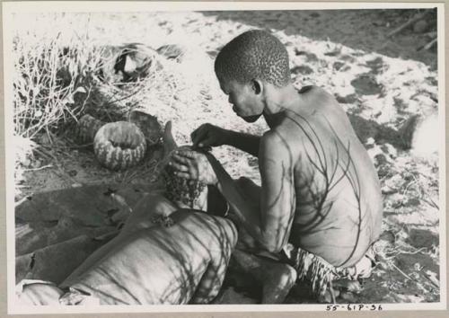 !Gai seated, cutting another man's hair