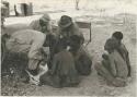 William Donnellan, Oukwane, and a group of people naming the parts of the animal



