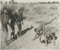 Boys from Oukwane's group and "visiting group" playing an ostrich game


