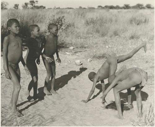 Boys from Oukwane's group and "visiting group" playing an ostrich game


