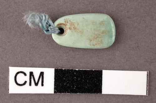 Turquoise pendant, oblong - 1.4 x .7 x .2 cm.