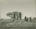 Children dancing on an anthill



