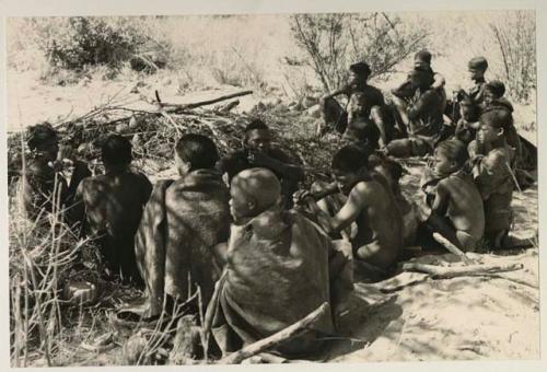 Members of the visiting band from Okwa sitting with Oukwane's group, in Oukwane's werft
