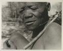 Close-up of Oukwane's hand demonstrating how to play a musical bow

