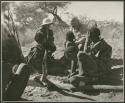 [No folder title]: Group of people sitting and talking with Laurence Marshall and Lorna Marshall (print is a cropped image)