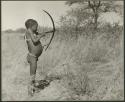 "Boys playing at hunting": Boy shooting with a bow and arrow (print is a cropped image)