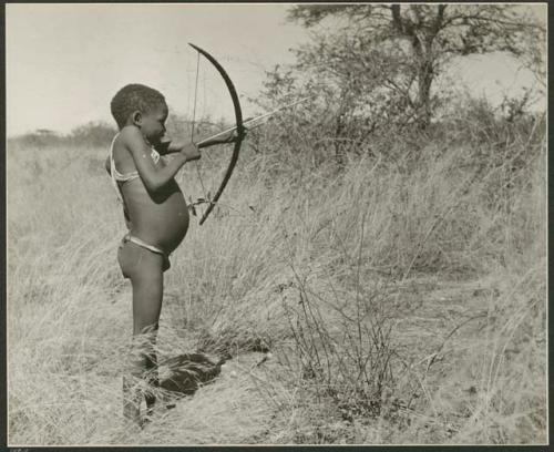 "Boys playing at hunting": Boy shooting with a bow and arrow (print is a cropped image)