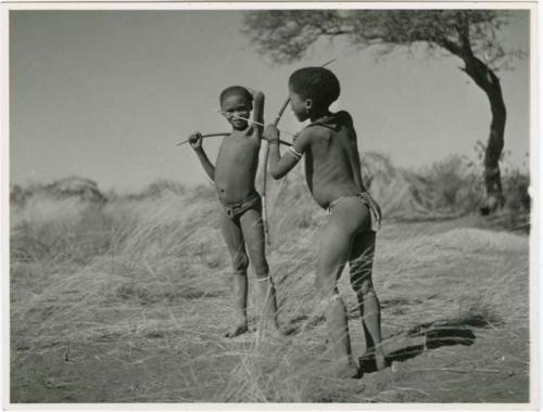 "Boys playing at hunting": Two boys holding bows and arrows (print is a cropped image)