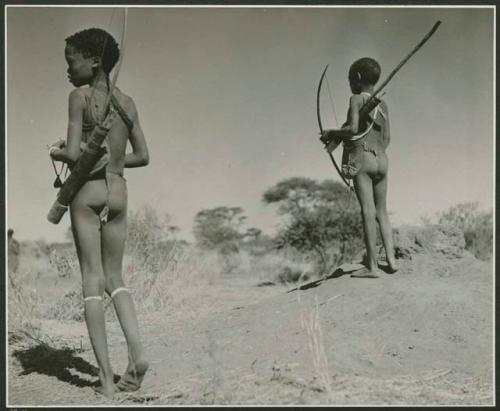 [No folder title]: Two boys carrying bows and quivers (print is a cropped image)