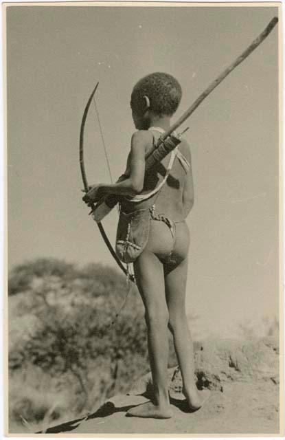 [No folder title]: Boy carrying bow and quiver (print is a cropped image)