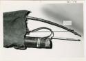 Hunting equipment: Hunting bag with bow and quiver, with a ruler for measurement