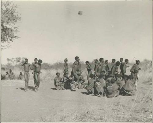 Group of Ju/'hoansi dancing; three medicine men in early stages of trance
