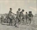 Group of Ju/'hoansi dancing, with "/Gao Music" in foreground
