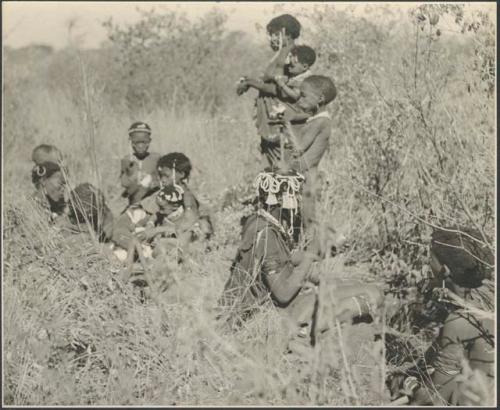 Group of women and girls digging for roots

