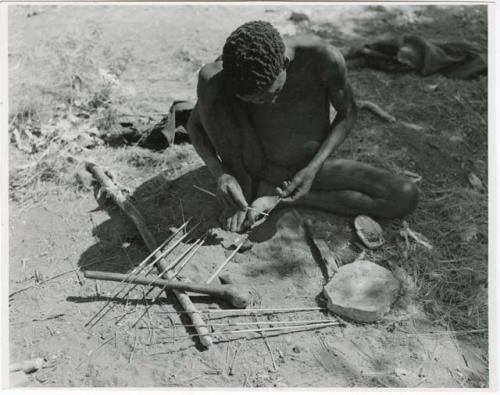 [No folder title]: "Gao Medicine" applying poison to arrows (print is a cropped image)