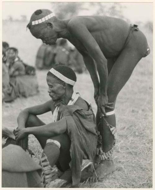 "Dance at Tsho/ana, Daytime": Medicine man leaning over ≠Gao, husband of /Goishay (print is a cropped image)