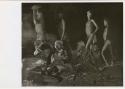 "Night dance at Tsumkwe 1957-8, some published in my [Lorna Marshall's] dance paper": Women assembling and starting a fire early in the dance (print is a cropped image)