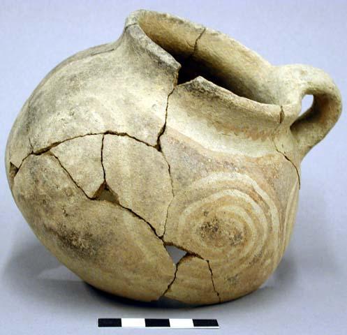 Pitcher. spherical, wide mouth, rounded base. single handle. body repair, sherds