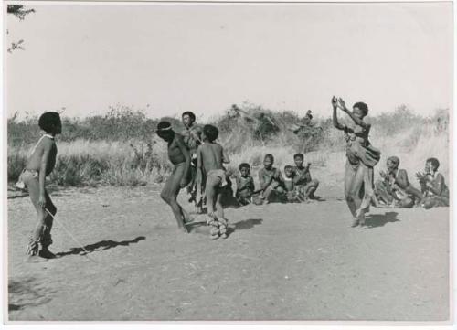 "Daytime dance at Gautscha": /Naoka (Gao Medicine's first wife) and boys dance at the beginning of a dance (print is a cropped image)