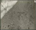 "Names on baobab trees": "I[?]. Berger  8.4.33" carved in the trunk of a baobab tree, close-up (print is a cropped image)