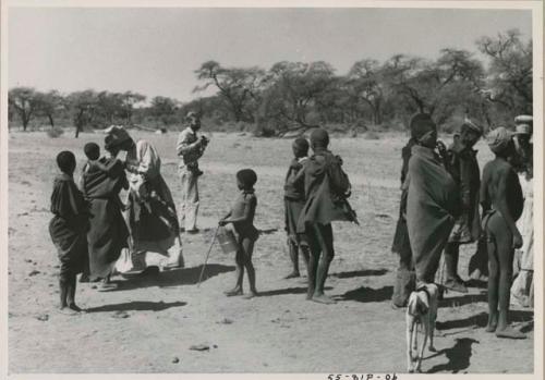 Group of people standing, including Daniel Blitz holding a camera




