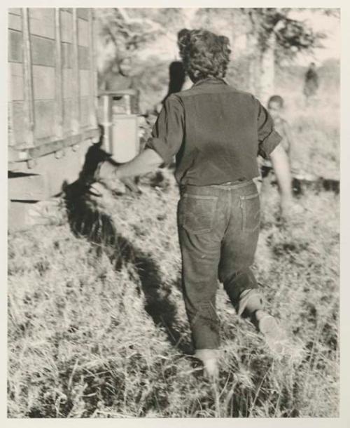 Elizabeth Marshall Thomas walking toward expedition truck

