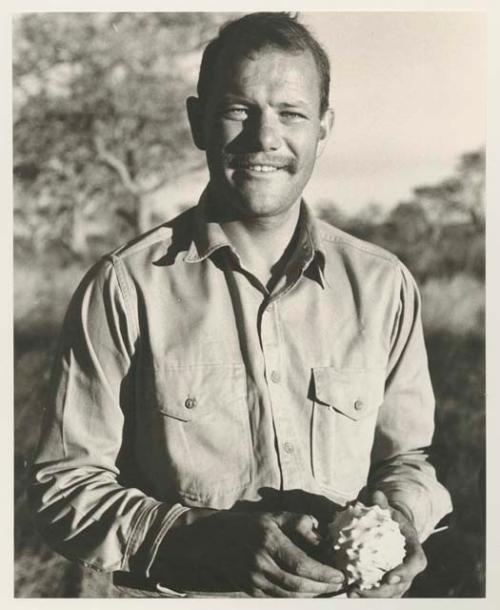 William Donnellan holding a cucumber, portrait


