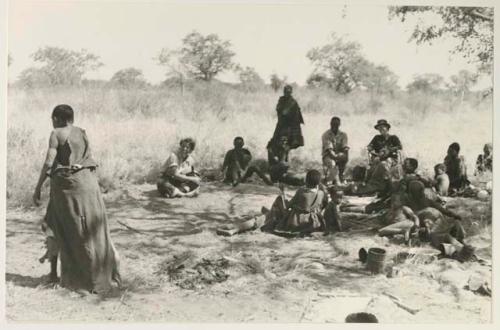 /Naoka dancing, and a group of people watching including Kernel Ledimo, Lorna Marshall and Elizabeth Marshall Thomas
