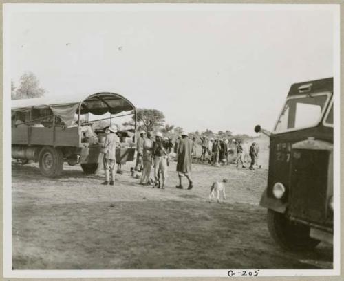 The WNLA (Witwatersrand Native Labor Association) convoy which stays over-night at Cho/ana arriving and the cook starting the fire to prepare supper (print is a cropped image)