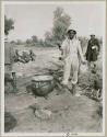 WNLA (Witwatersrand Native Labor Association) cook and his cauldron of porridge (print is a cropped image)