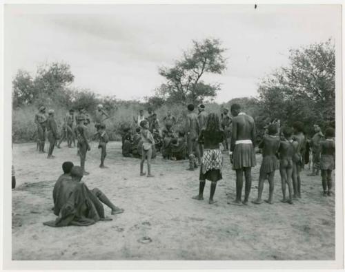 The March 1 daytime curing dance at Cho/ana, group of people with others from Muremi's kraal present (print is a cropped image)