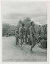 Curing dance for a sick baby at Moremi’s farm; men dancing behind the women (print is a cropped image)