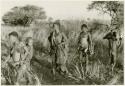 Tsekue carrying N!whakwe, two other women, and a boy dancing (print is a cropped image)