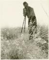 John Marshall photographing tsama melons (print is a cropped image)